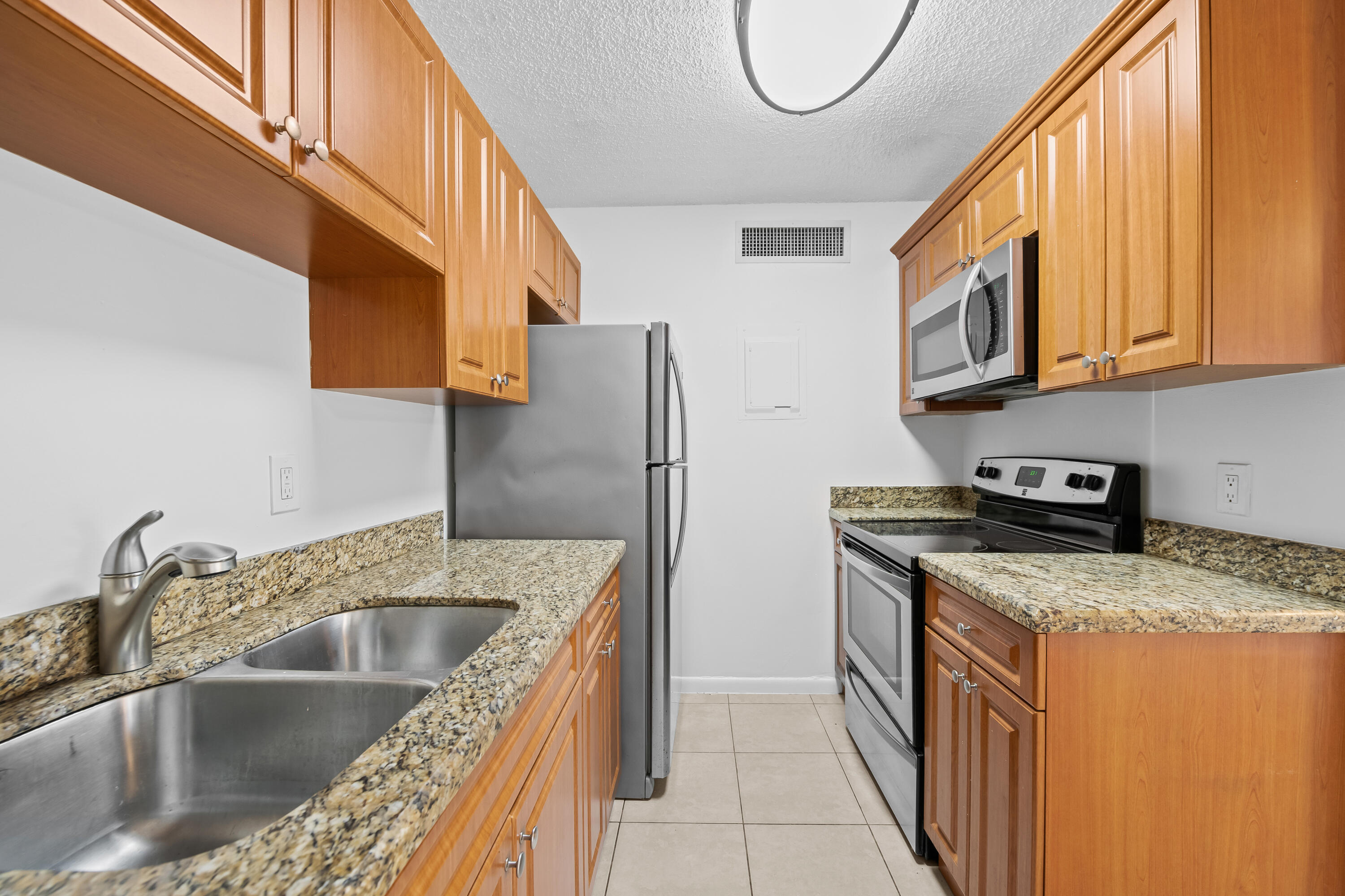 Freshly painted and move-in ready, this charming first-floor 1-bedroom, 1-bath unit features a private fenced patio—perfect for relaxing or entertaining. Enjoy the convenience of an in-unit washer and dryer, assigned parking, and access to a gated community with a pool and  walking paths.
Ideally located just minutes from  City-place/ Rosemary Square and Palm Beach Outlets, as well as schools, restaurants, shopping, and public transportation.
A perfect opportunity for comfortable and convenient living in a prime location!