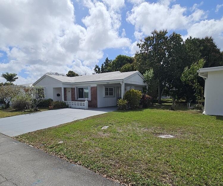 Nice home in 55+ community for a great price. Large master bedroom. Washer and dryer in utility room. Family room for relaxing. Tiled Floors Some impact windows. One carport. Water heater 2022. Seller will pay for a new tile and flat roof, also new central AC at closing at full price Can provide the roofing estimate at request.