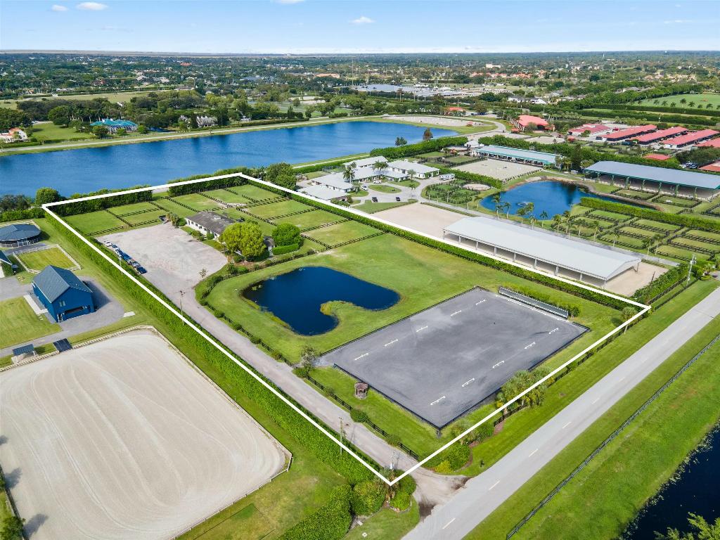 This is a wonderful opportunity to purchase a 5.37 acre working equestrian facility in one of the most prestigious neighborhoods in heart of Wellington, Southfields at Palm Beach Polo. The sixteen stall barn with a club room/office, feed rooms, air conditioned tack room and two apartments has been well maintained. There is plenty of grass turnouts and parking. A covered arena and residence is possible . Walking distance to the Palm Beach Equine Veterinary clinic and access to the Wellington trail system to hack to the horse shows or take a relaxing ride around town.. It's just a short Jaunt to Palm Beach , marinas, beaches and the airport. This superb location in the American horse show capital offers luxury equestrian lifestyle at its finest. So many possibilities.