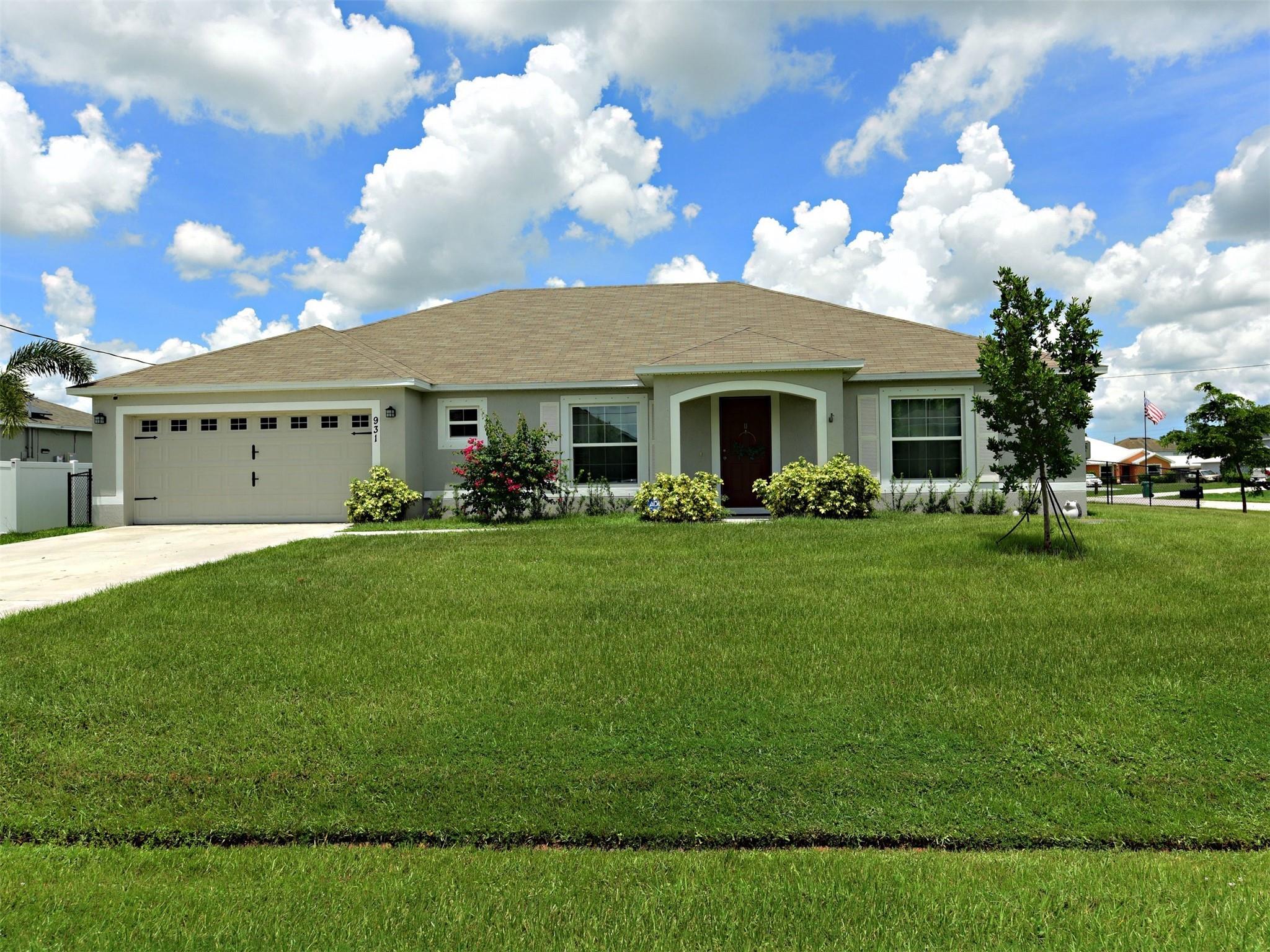 Move right into this 3 years young beautiful single level ranch style home (previous Holiday Builder model) situated on a 5ft fenced-in beautifully landscaped corner lot! NO HOA! Enjoy open concept living with lots of natural light, cathedral ceilings, split bedrooms floor plan, SS appliances, new water heater and a spacious backyard with fire pit and mango tree-perfect for a pool, children, pets and family gatherings. Close to shopping, restaurants, entertainment, highways, hospitals and fabulous beaches!