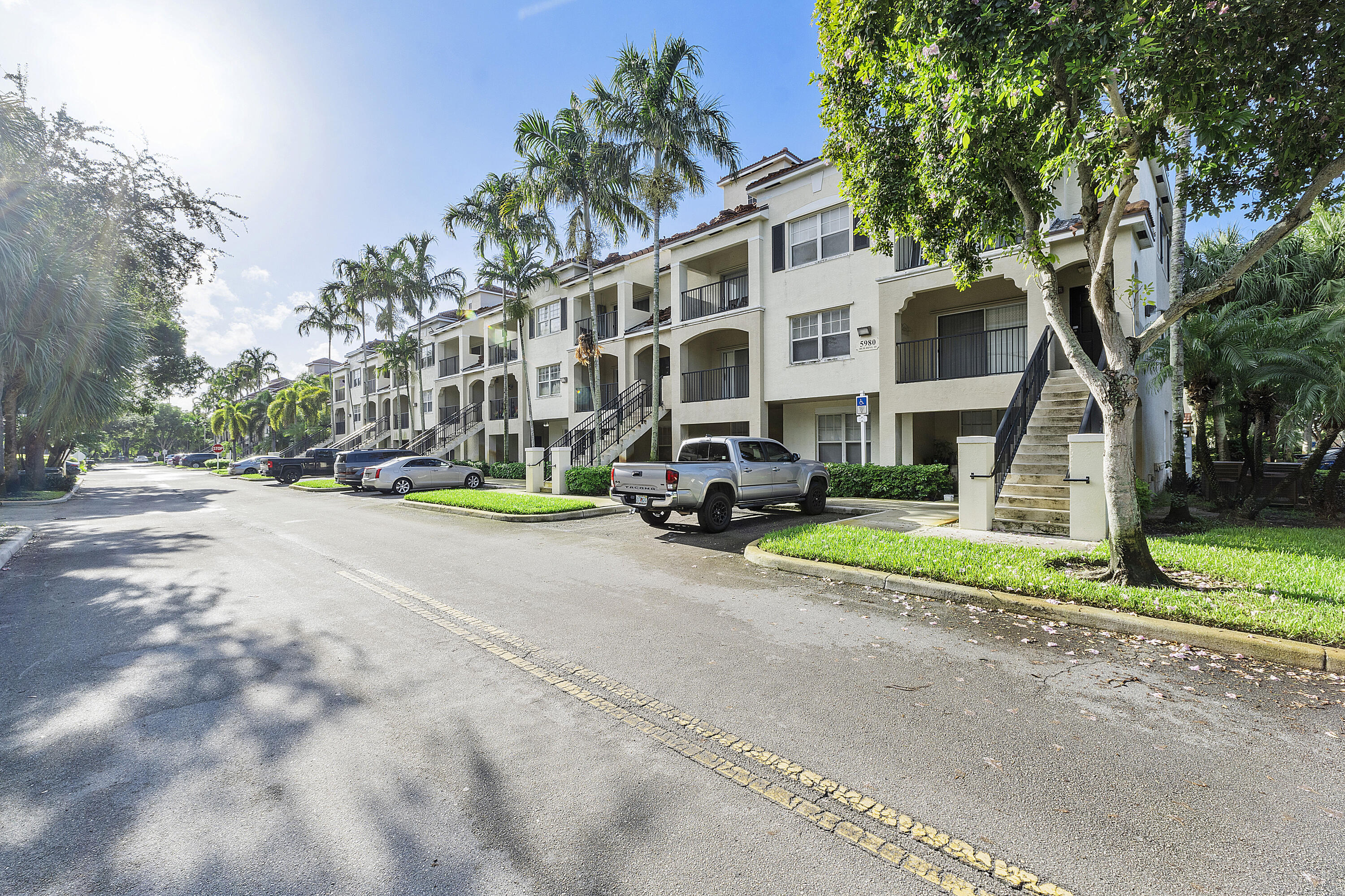 First Floor w/attached garage 2 bedrooms, 2 bathrooms,  in the GATED Ed Poinciana in Coral Springs. (No Stairs) Crown molding in living room and tile throughout. Maintenance includes basic cable, water, pool, roof, insurance, fitness center and club house. Great location!