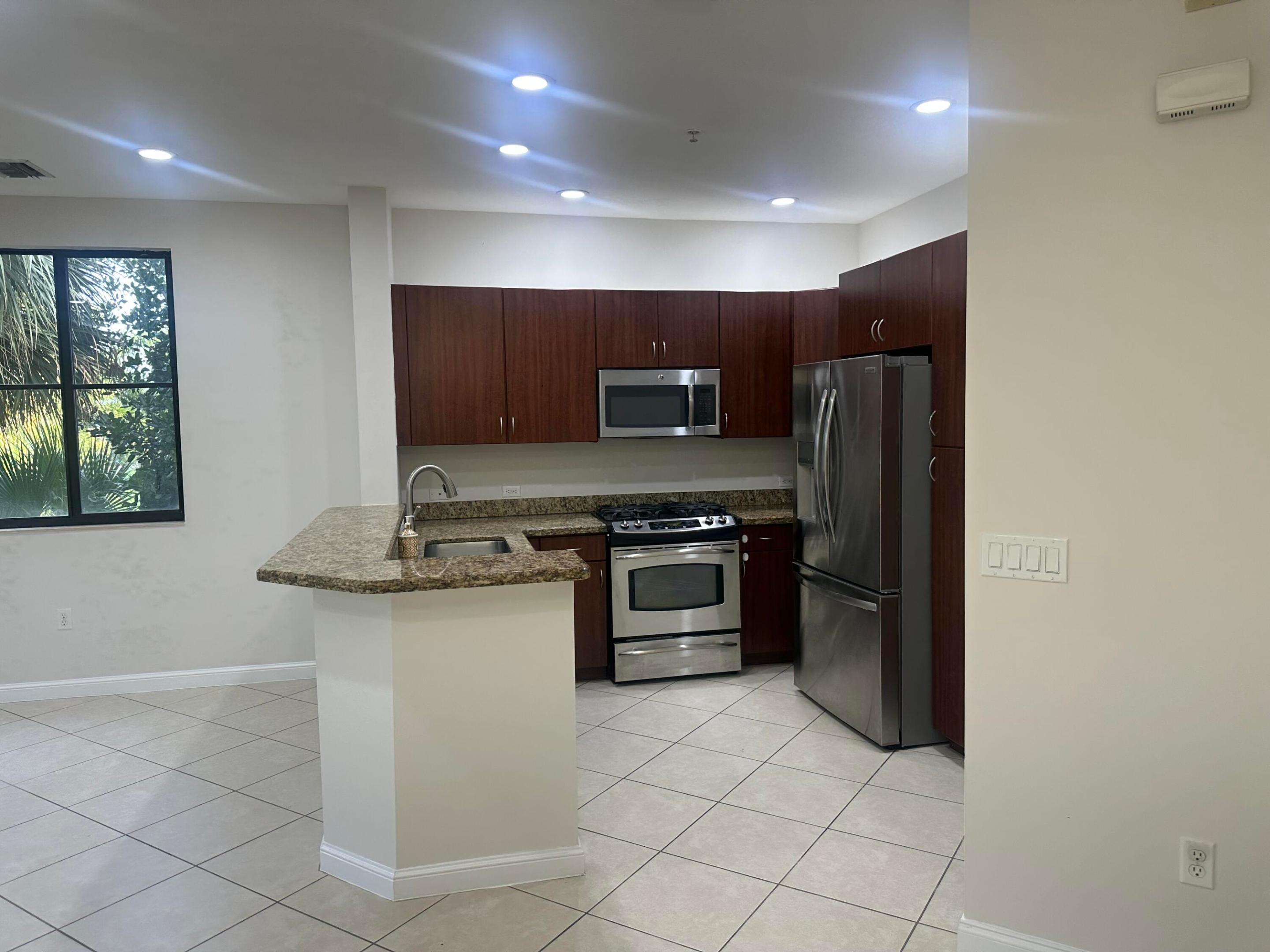 Welcome to prestigious Artesia! This freshly painted 2BR/2BA split-bedroom condo is ideally located just minutes from Sawgrass Mills Mall, Amerant Bank Arena, dining, and major highways. Features include wood cabinetry, granite countertops, stainless steel appliances, gas range, gas hot water heater, in-unit washer & dryer, new dryer, 2021 A/C, and impact windows for added peace of mind. Relax or entertain on the oversized screened patio with two sliding glass doors. Includes two assigned, secure under-building parking spaces. Artesia offers exceptional resort-style amenities including a spectacular clubhouse, fitness center, resort-style pool, basketball, tennis, sauna, and a vibrant social calendar. Rentals permitted after one year of ownership.