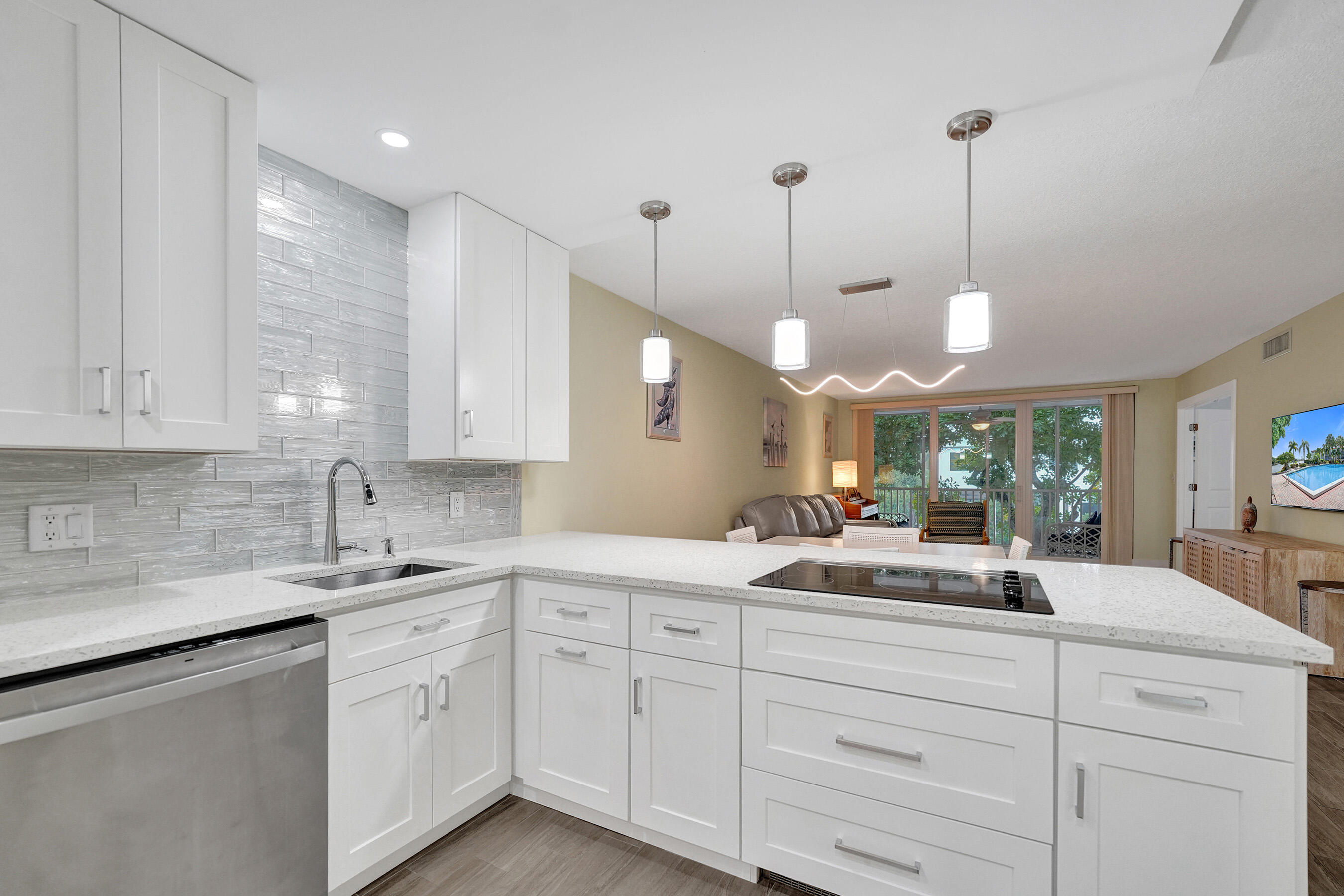 Seller Motivated! This is the one you've been looking for!!! Enjoy Florida  living at its finest in Palm Aire at Coral Key in Lighthouse Point. It's a cul-de-sac via land and a peninsula on the ICW with 1020' of seawall and 2040' of deep water boat dockage. This is a hidden gem, a quiet community in the highly desirable, boater's dream neighborhood on the ICW. This stunning, spacious and updated 2/2 unit is located in one of four garden apartments. Completely updated from modern baseboards to ceilings, doors, windows, bathrooms, kitchen and new A/C. Washer/Dryer located in the unit. Each building has a full size propane grill and a car washing station for resident's use. The community offers a clubhouse, large heated pool, shuffle board and beautiful manicured gardens directly on the ICW.