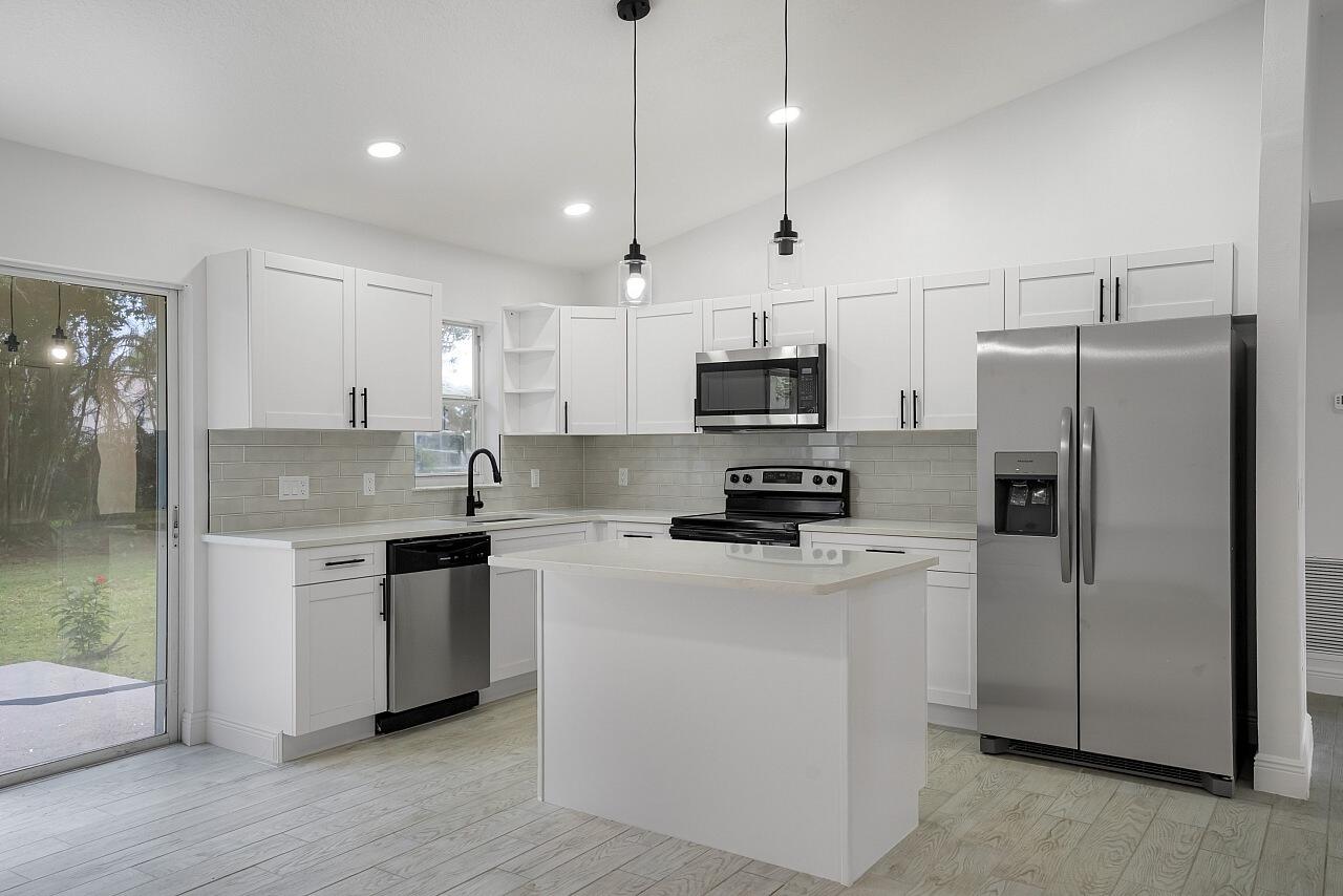 Prime Sebastian location. Close to Riverview park, boat ramp, parks, shopping/dining. This perfectly updated home features 3 beds, 2 baths, split floor plan & 2 car garage. Upgraded kitchen with island, quartz countertops, custom backsplash, crisp white cabinets, pantry, black fixtures & new stainless steel appliances. The primary has a custom remodeled bathroom, walk-in closet & tile shower. Tile plank flooring, fresh paint, baseboards & light fixtures w/ remote-controlled fans add a fresh touch throughout. New drain-field, 2023 roof, 2026 W/H, 2025 AC. NO HOA