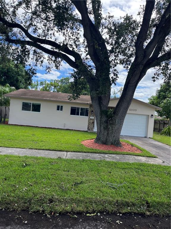The house is completely remodeled except the roof. All tile floors. All doors, windows, and garage are impact.