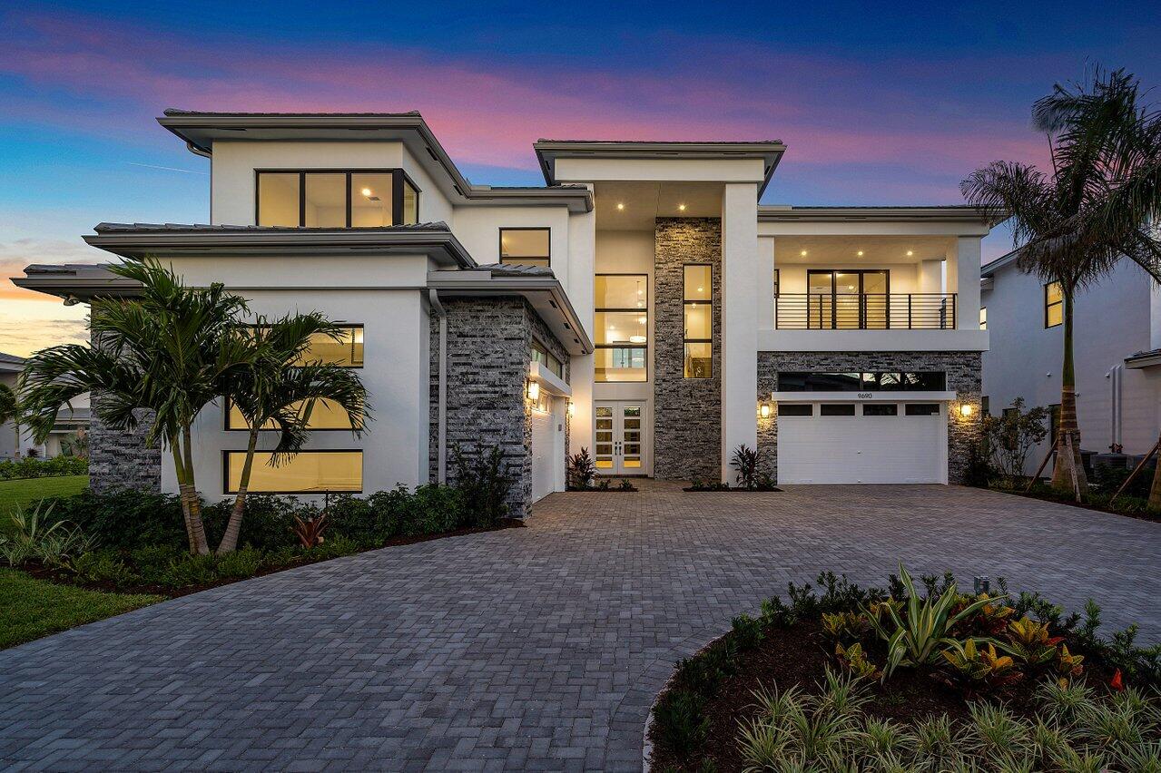 Set in the prestigious Boca Bridges Community, this Brand New/never lived in home is the perfect contemporary retreat. The highly sought-after Riverside model is perfectly situated on an oversized corner lot. Exquisite finishes include a glass contemporary stair railing, wide plank white oak floors, circular driveway, a gourmet kitchen with black cabinets (Level 5), 48'' Wolf Range with 6 burners and griddle, 2 Bosch dishwashers and a Sub-Zero refrigerator. Luxury living is redefined at Boca Bridges, complete with a 27,000 square-foot Clubhouse set on over 7 acres.  Residents have access to fabulous resort amenities, including a gourmet restaurant, beach entry pool, kids splash pad, tennis and pickleball.