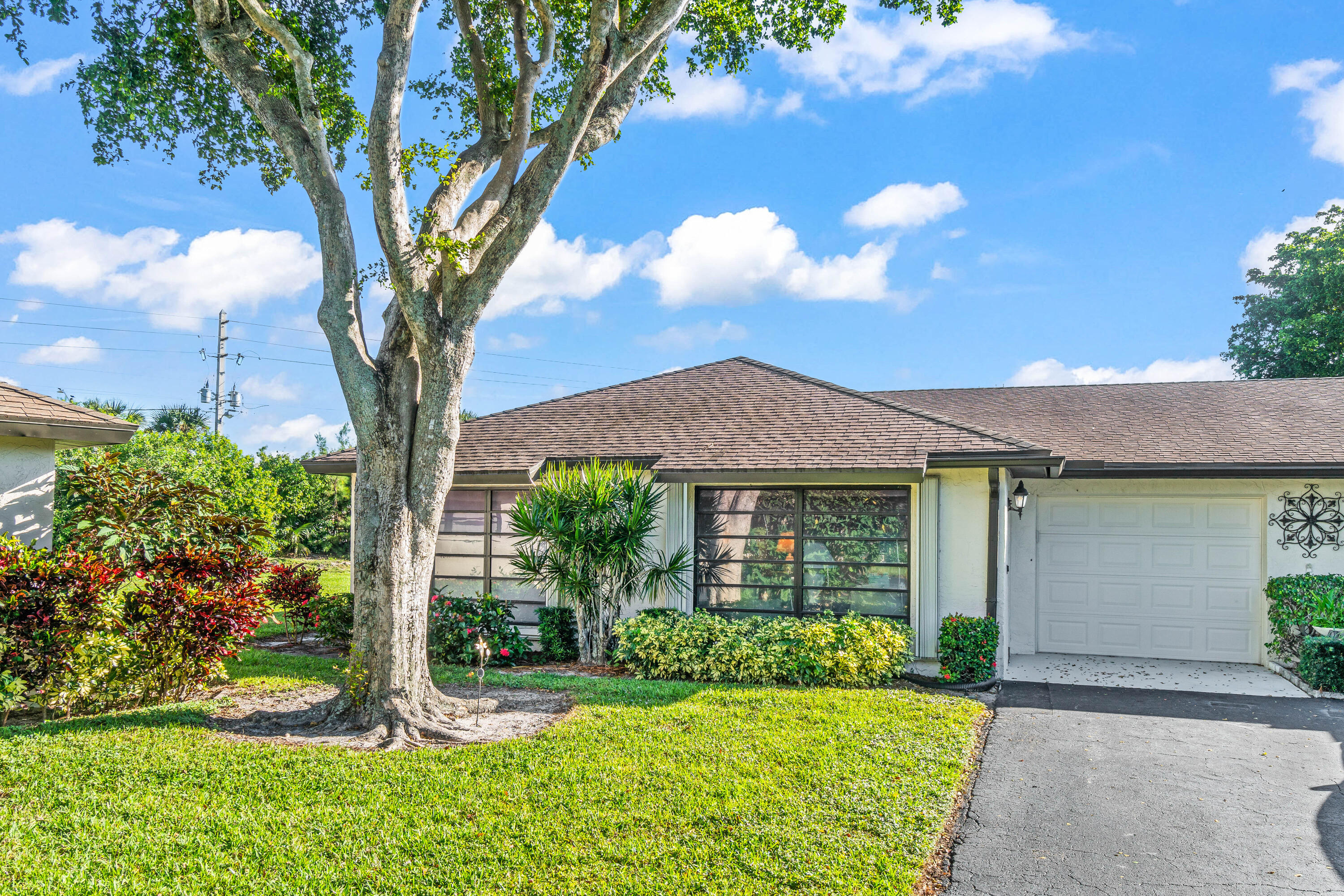 Priced to sell! This well-maintained home offers comfort and peace of mind with a new water heater and A/C. Accordion shutters provide full storm protection. The master bathroom has been tastefully updated with a modern walk-in shower, and the guest bathroom features a newer vanity. Move right in and start enjoying easy Florida living! Community amenities include: Six sparkling Pools, Exterior Maintenance, Roof Maintenance and Lawn Care, and Water, Basic Cable, and Internet. Conveniently located near I-95, the Turnpike, and local shopping.