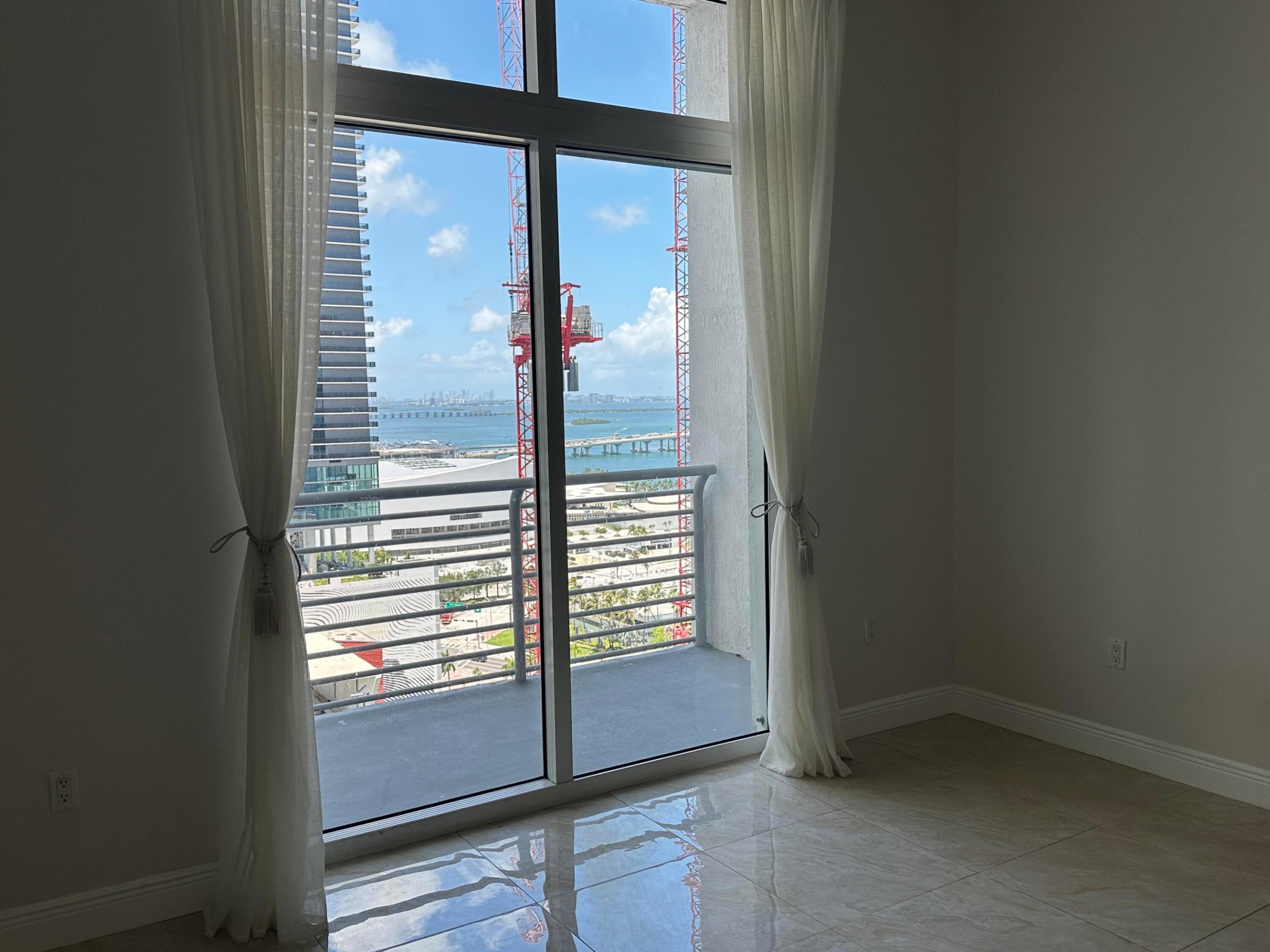 LOCATION, LOCATION, LOCATION! Enjoy breathtaking water and skyline views from this unique penthouse residence in the heart of Downtown Miami. Featuring soaring 12-foot ceilings, this thoughtfully updated unit has been enhanced with a custom glass wall, creating a true 1-bedroom, 1-bathroom layout. The modern kitchen is equipped with stainless steel appliances, granite countertops, and ample storage.  Located in the highly desirable Loft Downtown, residents enjoy a full suite of amenities including a resort-style pool, fitness center, sauna, stylish lobby, outdoor lounge areas, gated entry, and 24-hour concierge and security.  Ideally situated just steps from the Metromover and municipal parking, and within walking distance to Bayside Marketplace, the Kaseya Center, museums, theaters, resta