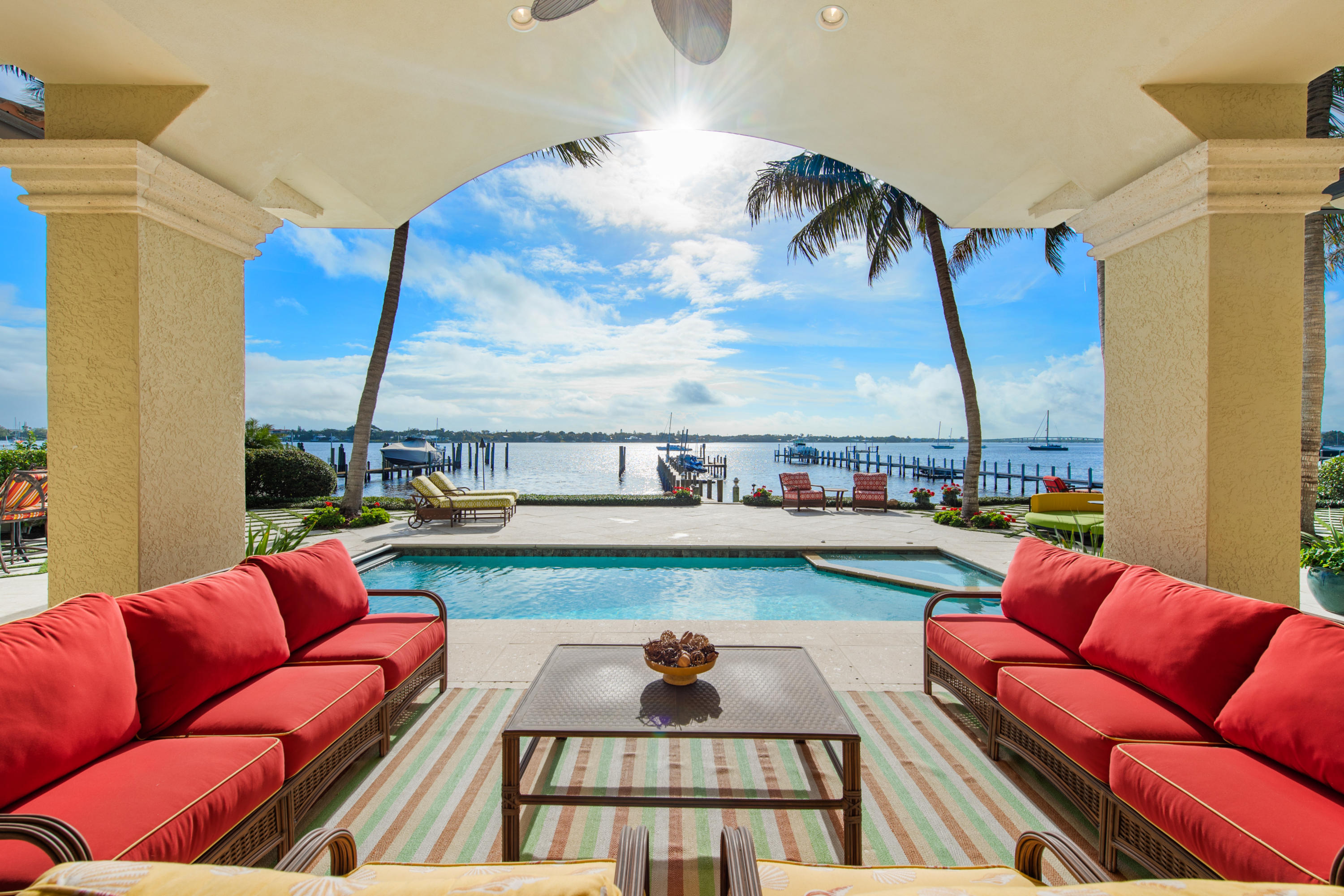 One of Palm City's Grandest Estates comes to market in one of the areas most Exclusive and Premier Waterfront Communities. Over 10,000 SF with no detail spared! Bring multiple vessels, including room for up to 60' boat, plus 27,000 pound lift, 2 jet ski lifts plus a floating dock. Exquisite master bedroom includes large sitting area, morning kitchen and His and Her closets PLUS a stunning dressing area. Spectacular dining room with custom built-in wine units (200 bottle capacity). Chef's gourmet kitchen with 2 Sub-Zero refrigerators, Viking cooktop, & double ovens. Elevator, Game Room, Exercise Room, Media Room, Custom Office and more! Impact windows and doors. Completely turn key. List of upgrades and options available. Truly a masterpiece to see.
