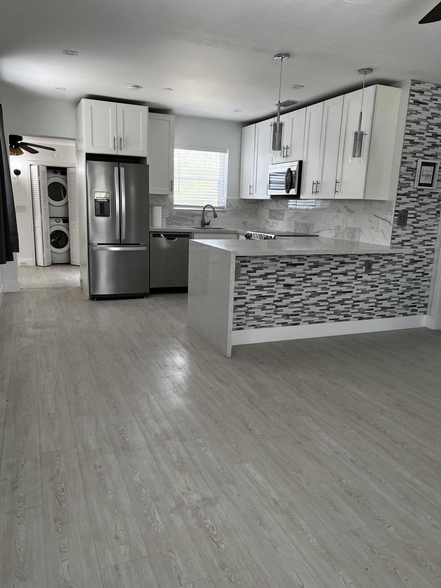 Single family home featuring 2 bedrooms plus a bonus room that can be used as den/office/3rd bedroom. Completely remodeled. 2019 roof, plumbing, and vinyl flooring. 2025 A/C. 2024 Water heater. Updated kitchen with stainless steel appliances. Large backyard with room for a pool plus room to park your boat. Amazing location in East Boynton minutes from the beaches and the highways.