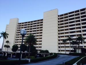 Greet the gorgeous sunrise from your balcony in this updated unit facing Lake Worth.  Upgrades include newer cabinetry with KitchenAid appliances, porcelain tile flooring and berber carpeting, custom built-in entertainment unit with wide-screen TV, solar shades in LR and DR, plantation shutters in both bedrooms, California closets, in-unit Bosch washer and dryer, new water heater and 2-ton AC unit.