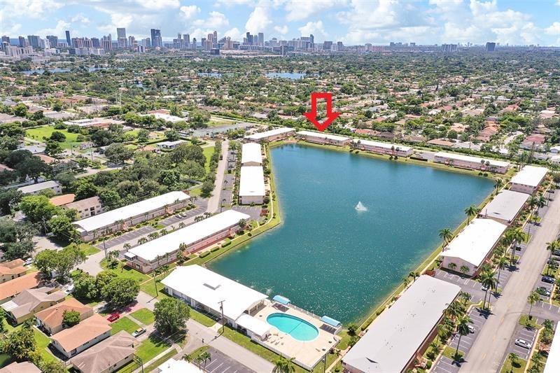 MOVE RIGHT-IN! Impeccable 1 bed / 1 bath with direct ‘LAKE VIEW’ sold ''FURNISHED, TURNKEY! Enjoy THE ''WATER VIEW ’‘every morning with your coffee on the building private terrace in the back! This unit offers a bright living rm, trendy custom banded sheer shades, modern entertainment center, Flat screen TV HDMI (2022), two leather electric recliner chairs & sofa bed. Remodeled kitchen with newer cabinets, countertop, backsplash & appliances. Water Heather (2022). New ceiling fans with remote.  Accordion shutters on all openings. Upgraded bath with new vanity, medicine cabinet, lighting & glass shower door. Bedroom well furnished with huge wall to wall closet Community with clubhouse, gym, library, pool, bocce and more! Cash only, 55+, rent right away (seasonal renting only).