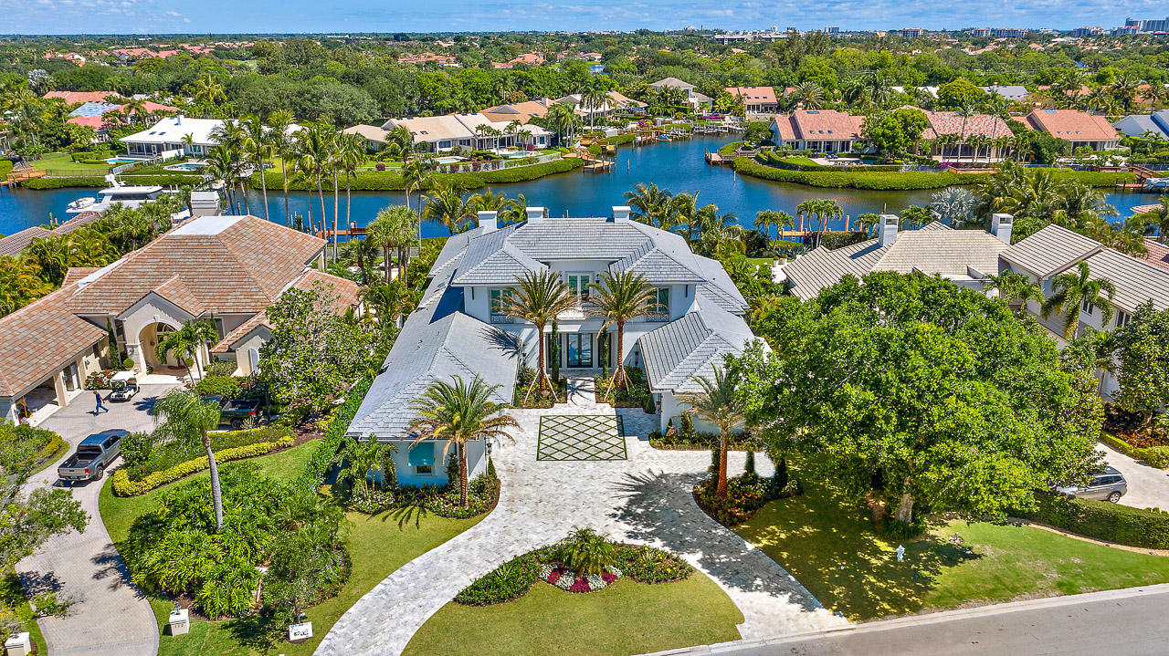 One of South Florida's most well-known club communities is about to become even more desirable. 134 Spyglass Lane, located in Jupiter's Admirals Cove, sets a new standard of luxury in Palm Beach County.  Boasting the finest craftsmanship & state-of-the-art features, this custom estate home will be the only home you want to see. The moment you enter, this estate will take your breath away with its immaculate finishes and spacious, open floor plan, highlighted by an expansive great room with custom fireplace. Additional features include a gourmet-chef's kitchen with the latest high end appliances from Blue Star, Sub Zero & Wolf, a separate butlers pantry, along with a bar & a wine cellar set to impress all connoisseurs. The elaborate, over-sized, first floor master suite is thoughtfully paired with a luxurious spa bathroom, en-suite laundry, and his and hers closets.  Her closet is especially dreamy with over 320 square feet with custom built-ins.  Enjoy the beauty of Florida weather in the spacious backyard, perfect for entertaining. Featuring a large, covered lanai with an outdoor kitchen, an over-sized pool with spa for 10, a putting green with chipping area and a fire pit, this outdoor space has something for everyone. Totally equipped smart home with many additional must-have features including 4-car garage with ability to add a lift, whole home generator, office and loft, this home will leave you speechless! 
 Firmly established as one of the top club communities in the country, Admirals Cove is the dream location for anyone wanting to live the true Florida lifestyle. Boating and fishing are easily accessible with the properties private dock for up to a 70' boat and quick access to the Jupiter Inlet, and golfers will love the immaculately maintained, 45 Championship holes.