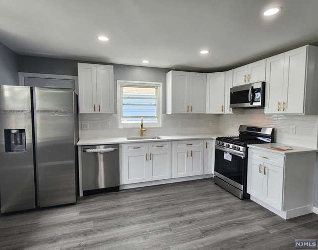 Newly Renovated 4 BDRM, 2 Full Bath single family house, with deck and finished basement with separate entrance perfect for entertaining. 1st floor has luxury vinyl planks installed, with engineered wood installed on the 2nd floor. Gas furnace / CAC unit approx 3 years old. Huge driveway with 4 car parking. House is located walking distance to the school, downtown shopping, grocery and dining; very convenient to NYC buses, and all major highways (46, 80, GSP, Turnpike & 17). Close to Hackensack hospital. Tenant pays 1 month Realtor fees.