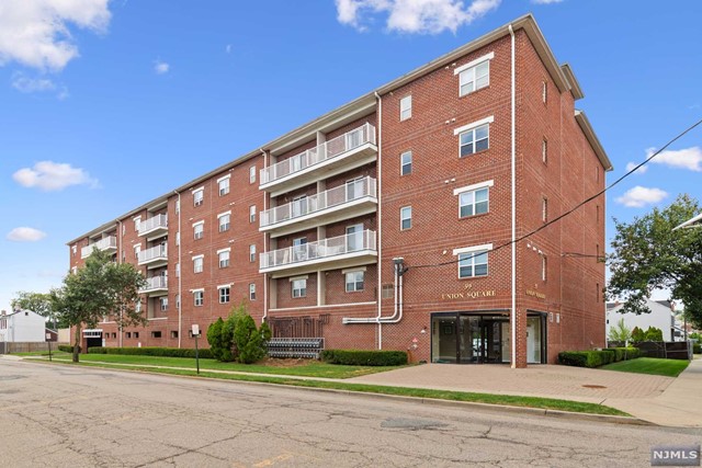 Welcome to this meticulously maintained and freshly painted 2-bedroom, 2-bath condo at Union Square in Hackensack. Built in 2005, this modern residence features low HOA fees and boasts an open-concept design with high ceilings, gleaming hardwood floors, and abundant natural light. Enjoy the spacious bedrooms, central air, and a generous living area that opens to a large balcony, perfect for relaxation. The property includes two deeded parking spots, one covered and one uncovered, and offers added convenience with an elevator, on-site laundry, and a community room. The secure, updated lobby includes an advanced door entry system. Ideally located near downtown Hackensack, you'll have easy access to Essex Street Train Station, NYC buses, and major highways including Routes 4, 17, 46, 80, and the Garden State Parkway. Ideal for both commuters and residents, this vibrant, rapidly growing town offers a perfect blend of comfort and connectivity. Don't miss out on this great opportunity!