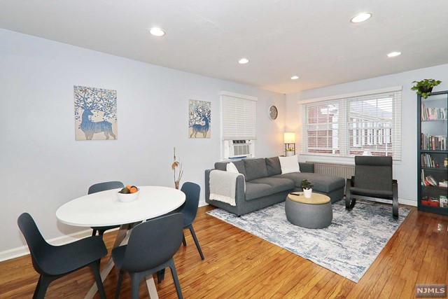 Light & bright updated end unit located across from the Maplewood library and town pool. Tucked away in the Maplewood Village Condo Association overlooking the courtyard with mature trees and landscaping. Steps away from Jitney. Move in ready home offers spacious living room, dining room, updated kitchen with granite counters, white cabinets, stainless appliances & new back splash. Hardwood floors, recessed lighting, double pane windows, front & back private entrances, and full attic. Steps away from Jitney. Condo complex Laundry Room below. Assigned parking space. NOT FHA approved. Not available to lease. Add'l overnight parking available in Library lot $20 per month. Buyer to confirm K-8 school with Board of Ed. Contingent on Seller's Purchase.