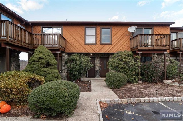 Welcome to Brookside Heights Unit 1C, a charming and modern townhouse nestled in Wanaque. This thoughtfully updated home offers a perfect blend of comfort, convenience, and contemporary style. The well-appointed kitchen is a chef's delight, featuring new stainless steel appliances and custom cabinetry. Whether you're preparing a quick weekday meal or hosting a dinner party, this kitchen is both functional and elegant. The open floor plan creates a seamless flow between the living, dining, and kitchen spaces, perfect for both daily living and entertaining. The sunken living room adorns a fireplace and sliders to one of three decks. Upstairs, you'll find two bedrooms and two bathrooms along with new carpeting throughout. The primary suite is a retreat in itself, with a private deck, en-suite bathroom for added convenience. The finished basement is a perfect bonus space for an office, playroom or family room with a walkout. The community also has a pool. Add. sewer fee: $305/quarter