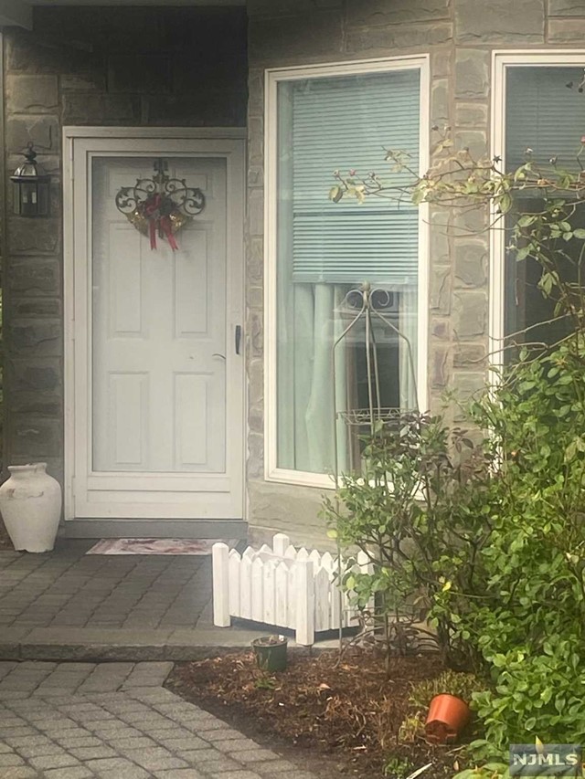 Opportunity knocks! Come see this sought after end in Cedar Hills development in Wyckoff. This unit has the added 'Sun Room' on the first floor, oversized dining room with sliders to the private patio. Large entrance foyer, office/den and bathroom on the first floor. Second floor has 2 full bath, 3 bedroom including en suite Master. Oversized walk in closets throughout. Use of clubhouse, pool and tennis is minutes from the front door as is retail, restaurants and shopping. Make this home your own!