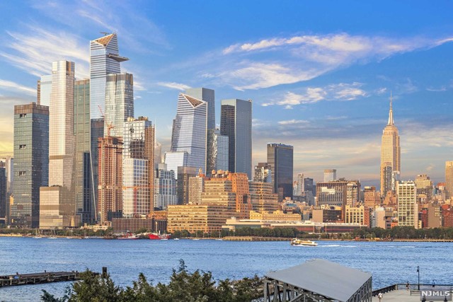 **OH Sat (7/29) and Sun (7/30) - 1-3 PM Rare to find Direct East-Facing 1300Sqft. 2BR/2.5BA Luxury home with 1 Deeded Parking Spot and Unobstructed NYC/River Views from each room in the Prestigious Waterfront building. The home greets every guest with Spectacular NYC/River Views and an overflow of natural light. The open floor plan features Hardwood floors throughout, Gourmet Kitchen with Granite counter-tops, S/S Appliances and Spacious Breakfast Bar. The roomy Master Bedroom features a Massive En-suite that includes Marble finishes, Double Vanity, Stand up Shower & Soaking Tub, and tons of Cabinet space. The 2nd bedroom also presents Direct NYC Views and is near the second bathroom creating the feel of a 2nd Master Bedroom. The luxurious waterfront community offers its residents Concierge, 2 Outdoor Pools, Outdoor Jacuzzi, 2 Gyms, Yoga Room, and much more! Conveniently located near the Ferry, bus stop, restaurants and shops.