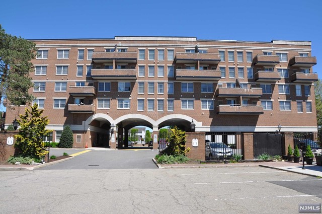 HOME SWEET CONDO! Lovely top floor 2 bedroom 1.5 bath condo unit located in the heart of Pompton Lakes. Immediately notice the stunning wide plank wood-style flooring, large bay window & crown molding in this spacious living room. Eat-in kitchen has white custom painted cabinets, newer white flooring and decorative back splash, plenty of counter space and enough room for a two-top table. Dining room has sliding glass door to privacy terrace. Large master suite with top to bottom windows inviting lots of sunlight making it bright and cheerful. At end of hallway is a walk in closet with vanity sink. Updated bathroom w/ newer shower and updated tile. Second bedroom with closet space and half bath conveniently close . Laundry room is tucked away in beautiful closet door. Personal storage space, gorgeous lobby area with couches chairs and fireplace. Assigned parking space for unit with plenty of off street visitor parking. Amenities include outdoor pool and elevator. NYC transit nearby