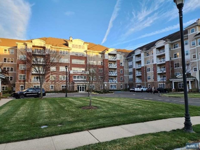 Welcome to the Beautiful Wanaque Reserve! This 2 Bedroom, 2 Bathroom Colfax Unit Will Not Disappoint! Enter The Spacious Crown Molded Living and Dining Room with Bonus Library/Den with French Double Doors Beyond the Foyer! EIK Kitchen with Separate Laundry Room! Its Owner's Suite Space Features a Tray Ceiling, Private Bath, and Its Own Walk-In Closet! The 2nd Bathroom and Bedroom are Located Off the Kitchen End of This Lovely Unit! The Exterior Deck Has An External Utility Closet and Storage Space! Enjoy The Serene Mountain Views Anytime of Year! The Unit Also Includes Its Own Assigned Parking Space, Permitting for Additional Garage Storage!