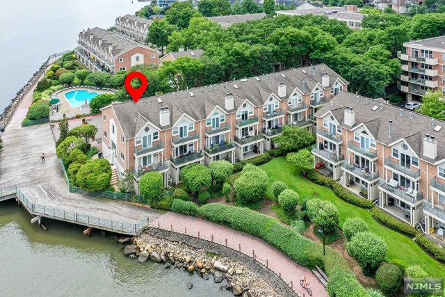 Grand Cove - Rare opportunity to rent a 3-story townhouse with unobstructed Hudson River & New York views in an exclusive gated community. This beautiful home offers 3 bedrooms, 2.5 baths, a recreation room, and an attached 2 car garage with driveway. Main level boasts living room with fireplace, sliding glass doors that lead to the deck, formal dining area & powder room. Second floor features a primary bedroom suite with full bathroom. Two additional bedrooms with full bath in hallway. Ground floor complete with a two-car garage, recreation room and patio. Community features include a 24-hour gate house, outdoor pool, gym and clubhouse. Due upon signing of lease: 1.5 Month security deposit, first month's rent, and one month broker fee. Building Fees: $100 move-in fee, $500 refundable moving day damage deposit. No Pets.