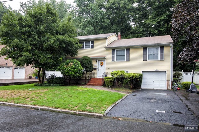 Four bedroom sugar maple split level home located on desirable East Hill street of Demarest. This home features bright living room, dining room, gourmet kitchen with granite counter tops and cherry wood cabinets, large family room with a fireplace, sliding glass doors to a patio and fenced yard with beautiful view of Green Acres. Huge master bedroom with master bath and spacious walk-in closets, 3 additional good-sized bedrooms and updated bathroom. Central air, one car attached garage. Hardwood floor throughout. Excellent school system. Easy commute to NYC. Landlord is responsible for lawn care and Tenant is responsible for snow removal. No pets. No smoking. Credit review and Tenant insurance required.