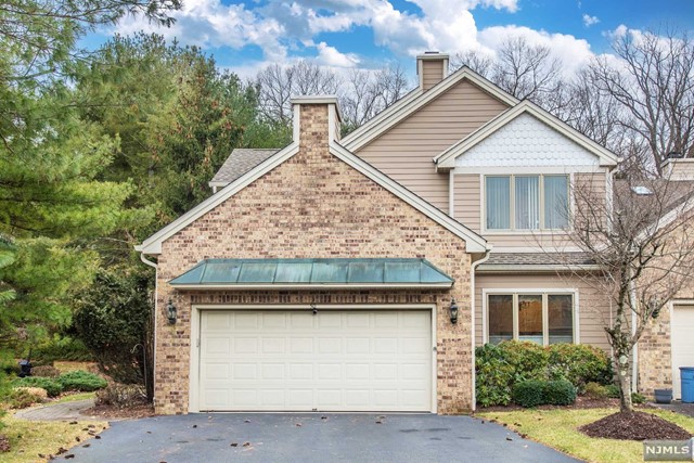 Enjoy all that "Longview" has ro offer in this fantastic "Devonshire II" end unit loaded with extras and all neutral decor. Enter into a gracious foyer with a high ceiling which welcomes you to the first floor that includes the large living room with a gas fire place. The formal dining room has a tier ceiling. The open and bright eat-in kitchen has a separate dining area with granite counter tops, 5 yr. old appliances and an extra large pantry. Adjacent to this is a beautiful "Butler Pantry". Upgrades include 2 furnaces and 2 air conditioners The newer bathroom on the second floor has double sinks and a unique walk-in-tub and shower. It also has a central vacuum system, and custom security system. This one is sure to go fast. See it today!!