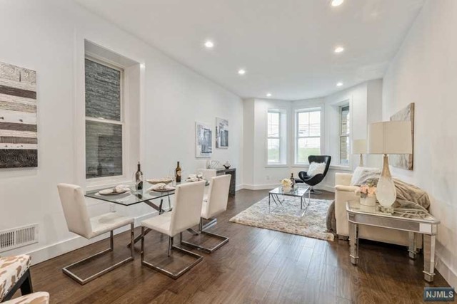 Exceptionally located in Weehawken, this historical and gorgeous duplex apartment completely renovated to a high standard mixes a contemporary sleek design and luxurious finishes. Remarkably finished over 2 floors, it features an open-concept floor-plan from the living room to the stunning kitchen peninsula boasting quartz countertop, black SS and fingerprint resistant appliances with smart technology features. The first floor of the apartment features 3 bathrooms and 3 bedrooms, including a master bedroom within good size en-suite bathroom and walking closet. The lower level features another full bathroom, a huge recreation space an additional office/bedroom and a beautiful private backyard As you walk through the apartment, take note of the premium features that this home offers: High ceilings, Anderson Windows, Central HVAC system, Smart door lock. Easy commute to NYC. LLC member has a real estate license.