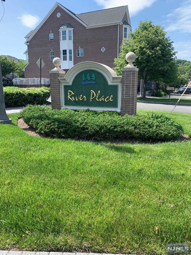 Open concept end unit Townhome Amsterdam Model in beautiful River Place. 1st floor offering Open layout Living Room, Dining Room & Kitchen with granite countertops & breakfast bar, which leads to Laundry room to 1 car garage. Hardwood flooring thru out & Full Bath. 2nd floor offers 2 bedrooms each with full bath, Master bath w/shower and jetted bath tub. Enjoy summer evenings taking a stroll along the private river walk. Close proximity to major Highways, shopping & a short distance to Wayne's NJ Transit Train & Bus. Enjoy a trip for ice cream in the evening or your coffee in the morning, minutes from your front door...