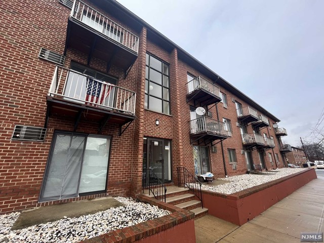 One Bedroom Condo Unit with Living Room, Kitchen/Dining Room and Full Bath. Hardwood floors. Tenant only pays electricity! Includes 1 Parking Space and Coin Op Laundry in building. Sliding Glass Door exits out to small, unenclosed patio and parking area. Close to Harrison Path Station. West Hudson Park just around the corner. No pets. No smoking.