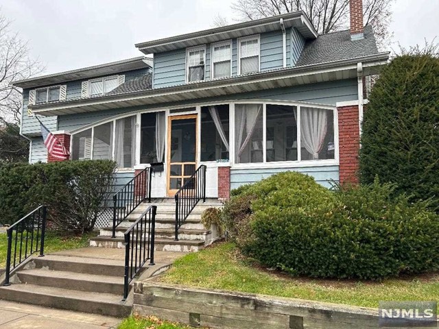 1/2 duplex (right side) rental. Large 3 season porch, living room, formal dining room, kitchen, bedroom and 1/2 bath down. Two bedrooms and full bath up. Basement with finished room. Private rear yard. Driveway parking.