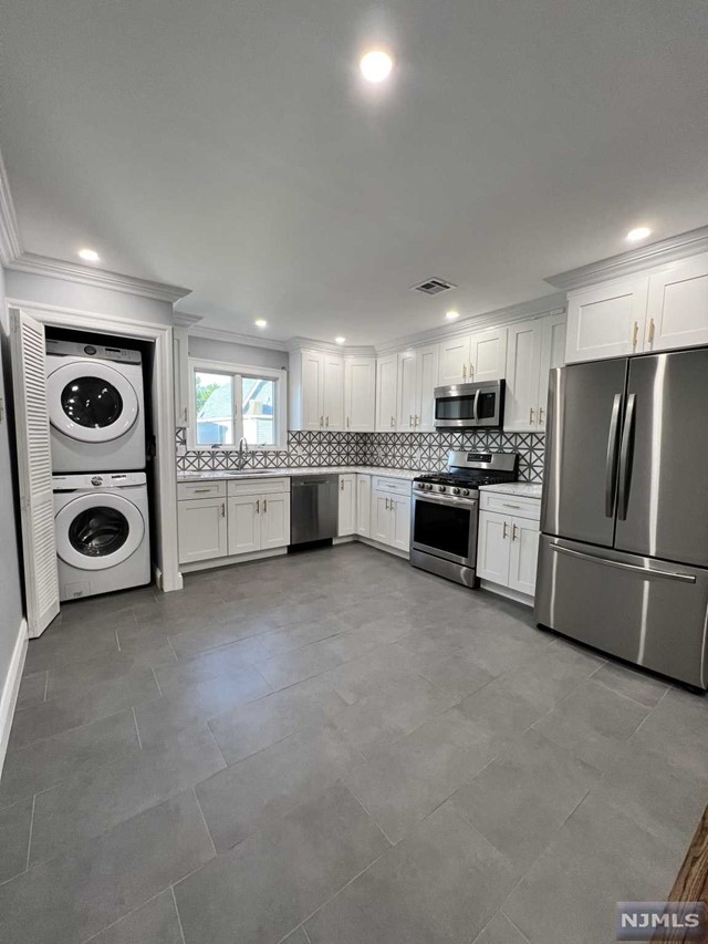 Welcome to this large 2 bedroom apartment. This apartment features 2 beds and 1 full bath. Totally gut-renovated and completely move in ready. Gleaming hardwood floors, a custom kitchen, extra large bedrooms with large closets, and laundry in-unit make this a dream rental! This unit also comes with parking for two cars. NO PETS.