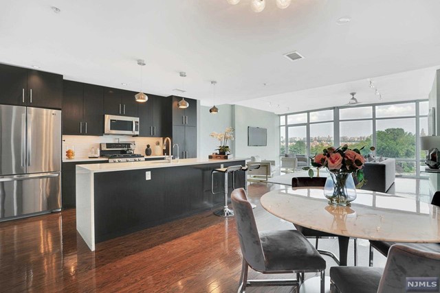 Welcome to the Aventine, an iconic architectural masterpiece with a glass facade set along the mountain of Edgewater where you will find stellar vistas of NYC/Hudson River from the floor-to-ceiling windows that will literally take your breath away from this utterly captivating home. An incredible 2BR/2.5BA 1,890sf duplex with an open layout floor plan showcasing picturesque city views on the first level from LR/DR/Kitchen. Chef's kitchen featuring SS appliances, Caesarstone Quartz countertops, & wine rack. Upstairs is a master ensuite with full windows & a master bath with double vanities, a soaking tub, & stand-in shower. Down the hall is an office nook, W/D, & second bedroom with its own private full bath. One-car garage parking & located in the heart of Edgewater, convenient to world-class shopping, dining, & entertainment, as well as easy access to NYC. Come home to this remarkable residence where you will feel like you are floating on air, 'Above the Hudson' & 'Above It All!'