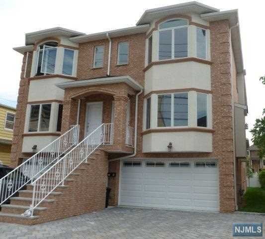 Large size duplex. Large Kitchen with Granite Counter Top and Stainless Steel Appliances. Hardwood Floor. Master Bath with Jacuzzi Tub. Attached 2 car garage. Close to NYC Bus Stop and Shopping.
