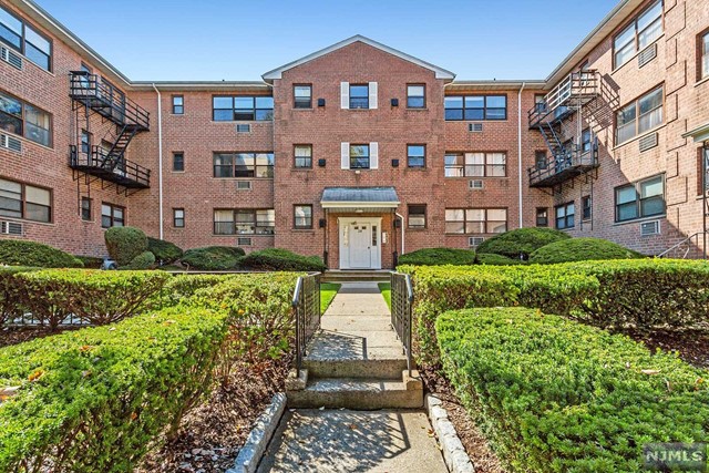 Spacious one-bedroom unit overlooking beautifully maintained grounds, and view of GWB! Kitchen w/breakfast bar, gleaming hardwood flrs, large open living rm w/dining area, good size BR. Also has Gym & laundry in building and assigned storage area. Also 1 assigned parking space. Great desirable Prospect Ave location close to all major highways, malls, and just steps from NYC bus! Move in ready and waiting to be your new home! Why rent when you can own! Even great investment opportunity! Call for your appointment today!