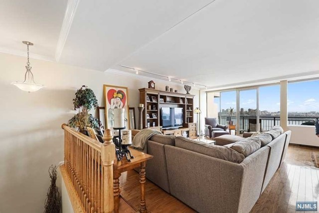LOOK AT THAT VIEW!!! Beautiful 3 bedroom/2 bath UPSPLIT Duplex Townhome style home on 3-Levels with views of NYC,THE HUDSON,and GWB that can only be found at Fort Lee's Horizon House co-op.TOTALLY MOVE IN READY HOME! Many upgrades including Hardwood Floors, Custom Railings,Moldings,Custom Closets-BRIGHT Home with Entry Foyer leading to a Living Room,Formal Dining Room,Well appointed galley Kitchen featuring Wine Fridge...Floor to ceiling windows w/24' terrace,providing an abundance of sunlight w/no obstructions. All bedrooms on top level- Featuring private suite with French Doors a Vanity Area,Walk-In Closet,and Renovated bath. There are 2 additional rooms which can be Bedrooms,a Den,or Office! There is also a 2nd full bath. Located minutes from NYC! MONTHLY FEES TOTAL $2766.48(MAINT $2297.50,VALET PARK $108,CBL/INT$48.90,CAP ASSESS $312.08) INCLUDES ALL utilities,Taxes,Parking,and u/l mortgage. Board approval required. Min. Gross income for cash buyer w/no debt $133k.