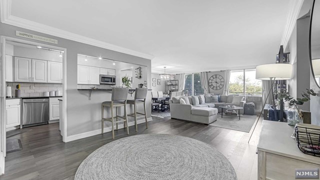 Stunningly renovated, open concept, 2 Bedroom, 2 Bath, full of light apartment in desirable Admiral's Walk with great amenities and outdoor living. This apartment offers east exposure, oversized living and dining area, floor to ceiling windows, master suite with master bath, hardwood floors throughout and plenty of great closet space. The 24/7 concierge building is located on the banks of Hudson River with easy commute to NYC by ferry or bus, near great shopping, restaurants and so much more!