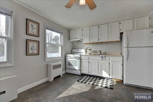 What a Location! A must see Multi-level, 2 BR END UNIT Townhouse-style Co-op in desirable Hastings Village. Conveniently located to everything Rutherford has to offer! (NYC transit buses, parks, shopping and dining). This Corner Unit has plenty of natural light and has been just freshly painted, hardwood floors under carpeting and ample closet space throughout. Low monthly maintenance includes TAXES, INSURANCE,HEAT, HOT/COLD WATER, SNOW REMOVAL, LANDSCAPING, PARKING. Why rent when you could own? Shared outdoor spaces for residents. 2 assigned parking spaces and coin laundry available. Easy to show