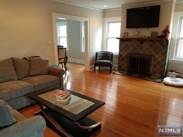 MUST SEE!!! 1 ST FLOOR AND FINISHED BASEMENT IN ABSOLUTE MOVE IN CONDITION IN NON-OWNER OCCUPIED HOME!! HEAT AND HOT WATER INCLUDED!!! MANY UPDATES DONE IN LAST YEAR INCLUDING NEW KITCHEN AND BATHS AND GLEAMING HARDWOOD FLOORS!!LARGE LR WITH FIREPLACE AND FORMAL DINING ROOM,ADDITIONAL SUNROOM OR OFFICE,KITCHEN WITH GRANITE COUNTERS/DISHWASHER AND FRIDGE(INCLUDED),LARGE FINISHED BASEMENT WITH A WET BAR AND PLENTY OF SPACE TO ENTERTAIN/FULL BATH AND LAUNDRY(WASHER /DRYER INCLUDED)..ROOM ON LEFT IN LAUNDRY ROOM NOT INCLUDED OR GARAGE BUT PLENTY OF STORAGE THROUGHOUT.. USE OF YARD AND DRIVEWAY ALSO INCLUDED..PETS ARE POSSIBLE ..SUBJECT TO FULL APPLICATION,CREDIT CK AND ABILITY TO PAY RENT..