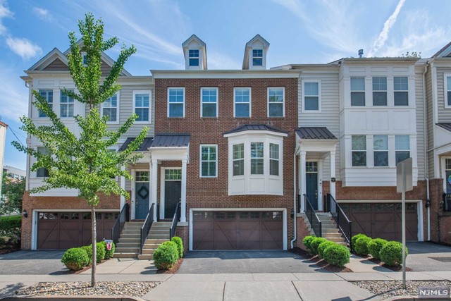 Stunning townhome situated in the heart of historic downtown Morristown.3 BR & 3.5 bath it offers a spacious & luxurious living experience. 3,340 sq. ft. of living space across multiple FLS it provides plenty of room for comfortable living. Townhome INCL. a convenient 2-car garage ensuring hassle-free parking & storage. Gourmet kitchen is a chef's dream featuring a LG center island, high-end APPLS, granite counters, wine refrigerator & pantry. A bright sun room adds to the allure of this home providing a serene space w/ access to a private yard & spacious deck, perfect for outdoor relaxation. Master BR suite is a retreat in itself, featuring a sitting RM, custom walk-in closet & a LG master bath complete w/ soaking tub, stall shower & vanity w/ dual sinks. 2 ADDT'L bedrooms w/ custom closets, main bath & the 2ND FL laundry adds to the functionality of the home. LL offers ample living space & bath. Walking distance to vibrant community w/ shops, restaurants & cultural attractions.