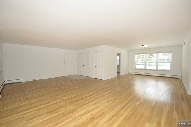 Updated 2 bedroom 2 bathroom apartment for rent in covetable Ridgewood. This apartment features tons of living space, hardwood flooring leads you to the open living room and dining room space that leads you to the ample-sized modern eat-in kitchen. The apartment is completed by a spacious Primary bedroom suite with an en suite bathroom, a hallway bathroom, and an additional bedroom with a large walk-in closet and sliding glass door leading to your patio and direct access to the parking deck, making transporting groceries a breeze! Located in the heart of Ridgewood this apartment is equipped with central A/c, baseboard heating, 1 parking spot included on a first come first serve basis or garage/ covered parking space at additional cost ( upon availability), Laundry is located in the complex ( behind the B building, or underneath the C & D buildings). Extra Storage units are available at additional cost. Perfectly located within steps away from transportation, shopping, and dining!