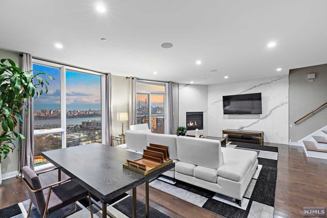 Modern Design Townhouse with New York City and Hudson River Views! Over 3300 square feet of living space. 3 large bedrooms;4th bedroom conversion possible on recreation level. Floor to ceilings windows throughout to enjoy the views from every floor and bring in an abundance of natural sunlight. Hardwood Floors, Private Elevator & 2 - Car Garage, Surround Sound, Nest Thermostat, Miele Appliances, Security Cameras, Gas Fireplace, and Rooftop Deck with Breathtaking Views.