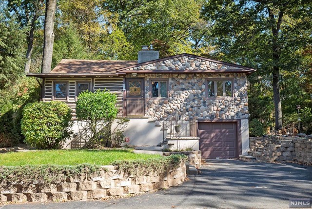Pines Lake Living at its best with this distinctive log home that has been updated with many modern features that offer comfort and convenience. Enjoy one level living with renovated kitchen and bath, living room with open loft, formal dining room, three bedrooms, laundry room, central a/c, recessed lighting, and entry foyer. Cozy up to a stone woodburning fireplace or gather around the firepit. Dine alfresco on your generous side deck equipped with bbq grill. The lower level has interior access via built in garage and offers mudroom, storage room, workshop and utility. Very private setting in a vibrant residential neighborhood. This lake community has easy access to NJ major highways and is less than one hour to NYC. Tenants will have access to exclusive membership priviledges including Pines Lake Beaches, swimming, paddleboarding, kayaking, fishing, tennis and playcourts and many community activities.