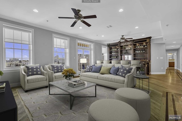 This 3 bedroom unit is on the Top Floor of an elevator building with approximately 1,749 square feet of living space. Kick off your shoes and relax in your spacious Living Room with a custom-built Mahogany Bar, complete with wine fridge and kegerator. Outdoor Terrace. Whether you are cooking for yourself or guests, you are going to love this Chef's Kitchen! High end appliances including Sub Zero Refrigerator, 6 burner Viking Stove and Viking dishwasher. Granite Countertops, Maple Cabinets. Perfect for entertaining. The large Master Bedroom has its own Terrace, Master Bath and custom-built Walk-in Closet. 2 additional ample sized Bedrooms with fitted closets. Hall Full Bath and separate Laundry/Utility Room. 2+ car garage within a garage, complete with its own double garage door securing your cars and belongings.. Did I mention the incredible Rooftop Lounge Area with amazing views?Perfect for entertaining or relaxing at the end of a long day. Luxury, space and convenience.