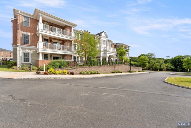 ONLY UNIT AVAILABLE features unobstructed view onlooking pool/tennis.Largest Primrose (2428 sq ft) end unit. Upgrades include large kitchen w center island, stainless appliances,granite counters, breakfast bar, and separate eating area w sliders to private balcony all of which open to a large family room w fireplace. There is a large living/dining room combination w dramatic tray ceiling, and a bonus den/office. Primary suite features walk-in plus additional double closet and upgraded bath. Additional features include convenient in unit laundry w separate service entrance for deliveries, newly installed humidistat, and newly carpeted BR's, two assigned indoor parking spaces, plus storage. Activities galore and newly renovated clubhouse w newly renovated kitchen,party room, exercise room, card and billiard room. A luxurious lifestyle.