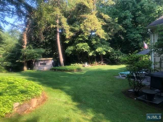 Showings will begin Sept 1!! Location !! Recently renovated house in a very desirable section of Closter. The property is at the end of a cul de sac. Tons of privacy with the house sitting on a little less than 1 acre. The first floor has a two car garage with a basement/tv room, laundry room and a massive storage room. The second floor has a renovated kitchen with GE and LG appliances and skylight, formal dining room, and living room, and a sunroom with extremely overside windows looking out at the backyard. Hardwood floors throughout. The top floor has 3 large bedrooms all with king and queen beds and windows with plenty of sunlight, and two full renovated bathrooms. This house is in a top location and has been very well kept with a lot of privacy and a very large backyard.