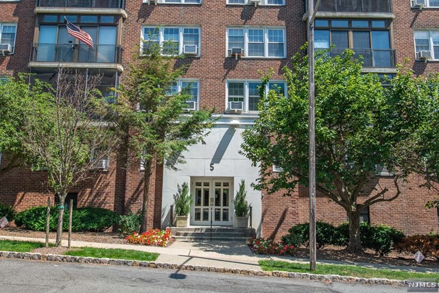Bright and spacious condo in the heart of Montclair! Located minutes away from the Wellmont theater, restaurants, Whole Foods, Montclair Public Library, and NYC transportation. This 2 bedroom 1 bath condo features an open concept living/dining room, parquet floors, large walk-in closets, galley style kitchen, and an enclosed porch to enjoy outdoor evenings. The sun-filled large primary bedroom has a huge walk-in closet for ample storage. Overlook the NYC skyline when entertaining on the rooftop terrace! The unit also includes an assigned heated garage parking spot, and on-premise laundry facilities. Come and live the Montclair lifestyle!