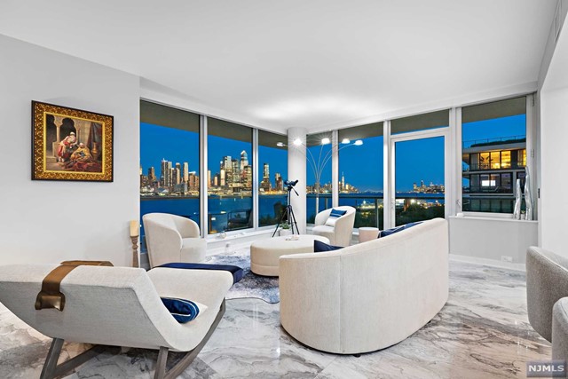 Welcome to The Avenue Collection Designer Model Home Res 511 the epitome of luxury living on the waterfront of Port Imperial. This premier SE corner home features a spectacular 400+ sf wrap-around terrace, 9'ft ceilings with it's architecturally sophisticated sleek design, floor to ceiling glass window walls that magnify the spectacular unobstructed panoramic views of NYC from the Verrazano Bridge up to the GW Bridge and Hudson River. Oversized living and dining area make for an effortless flow to encourage a lavish entertaining lifestyle with stunning chef's kitchen, European cabinetry, granite counters, Miele, Wolf & Sub-Zero appliances. This 3 Bed, 3.5 Bath all with en-suite baths offer NYC Skyline views from every room. Make the Avenue Collection your new home with 5-Star amenities including 24 Hr Concierge; state-of-the-art fitness center with sauna, steam shower, and yoga room; outdoor sun deck; social room with fireplace and grand salon lobby! Also for rent MLS#22042280.