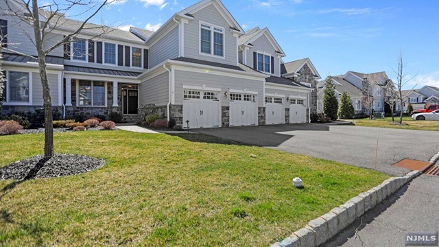 Live in Luxury at the prominent Reserves at Franklin Lakes! The Finest of Bergen County offering resort comforts & convenience in a prestigious community with endless amenities. This chic & modern townhouse is ready to move in & loaded with designer finishes. Elegant 2Stry Entry, 9'ceilings, formal DRw/Butler's Pantry, gourmet modern ElK W/Breakfast area, open entertaining flow to GreatRm w/Fireplace & sun-drenched windows, mainlevel Primary Bedrm Suite w/customFBath & WIC. Main level features spacious laundry rm, designer powder rm, direct access 2 car garage w/custom cabs. Step out of great rm to BREATHTAKING private rear yard w/full outdoor living & VIEWS! Upper level features expansive loft, office/study,2 spacious bedrms w/WIC and J&J Fullbath.Full Finished HUGE lower level w/Powder rm & storage! Closets Enjoy all of the amenities, inc, Club House, Fitness Center, Pool, Comm Rooms, tennis ct, walking trails, snow removal, allyear maintenance/landscaping & much more. Enjoy!